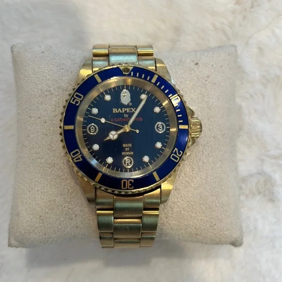 A Bathing Ape BAPE Bapex watch. Gold color bracelet and blue dial